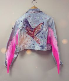 This stunning jacket is a totally one of a kind, unique piece. If you are going to a festival this summer, you will not see anyone else wearing a jacket like this !  Crafted using a pre-loved jacket, preventing waste and potential land fill, customised and embellished by me, in my little design studio in Wales. Decorated with iron on patches, sequins, gems, and fabulous neon arm tassels, this jacket with really make you stand out in a crowd.  jacket is UK size 12-14. slightly cropped, casual fit Bespoke Denim, Wrestling Clothes, Swift Party, Upcycled Jackets, Embroidery Jacket, Custom Denim Jacket, Festival Jacket, Denim Art, Denim Decor