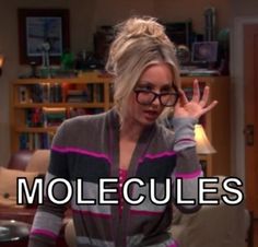 an image of a woman that is on the television show molecules with her hand up