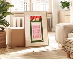 an easel filled with pencils sitting on top of a floor next to a potted plant