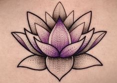 a woman's back with a purple flower tattoo on it