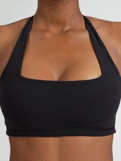 Features: Square neck sports bra Halter straps Shortline Removable bust pads Details: Fabric: NuBre (Nylon/Spandex) Medium Support Level Description: The Revolution Sports Bra is a short-line sports bra with a flattering square neckline and a medium level of support to highlight your best features. This bra has halter straps and is made with our signature NuBre fabric for a soft, second skin feel with high stretch retention. High Support Sport Bra, Sports Bra Big Bust, The Revolution, Jogger Shorts, Black Sports Bra, Short Shirts, Plain Black, Trending Gifts, Sports Leggings