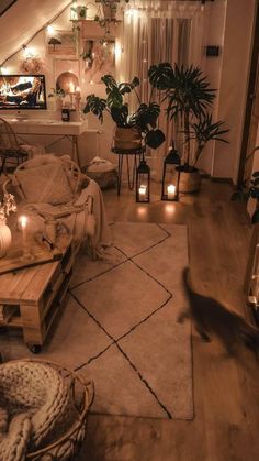 a living room filled with lots of furniture and candles on top of the rugs