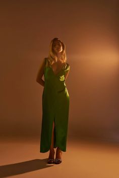 The Venus Maxi dress has a chic 90s relaxed fit and a plunging neckline. Made from certified Oeko-Tex Japanese threads with two beautiful front slits and delicate geometrical seams. All of our products are handmade by women in our Atelier located in Bogotá, Colombia. Plunging Neckline, Relaxed Fit, Maxi Dress, Green