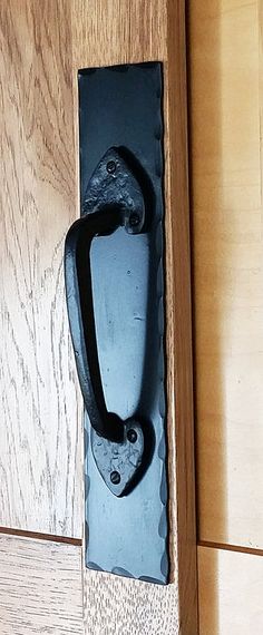 an old door handle on a wooden door