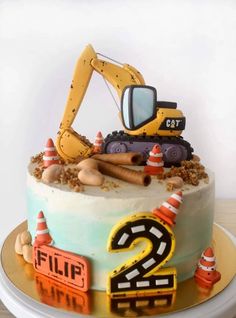 a birthday cake with construction equipment on top