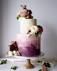 a three tiered wedding cake with flowers on top and the words instagram above it