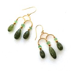 "Sparkling and finely faceted green chrome diopside drops are hung in triplicate from vermeil chandelier adding dressed up luster to this fine gemstone earring. The drops are accented by AAA genuine Columbian emeralds. The 14k gold fill hooks bring the length to a hair past 1.75\" long. Pair with the matching bracelet and necklace for a stunning set." Green Gemstone Dangle Chandelier Earrings, Columbian Emeralds, Green Chrome, Bracelet And Necklace, Matching Bracelet, Matching Bracelets, Mixed Metals, Saint Louis, 22k Gold