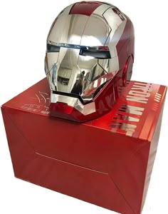 an iron man helmet is on display in a red box with the words iron man printed on it