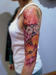 a woman with a flower tattoo on her arm