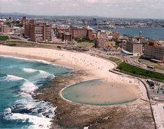 an aerial view of the beach and city