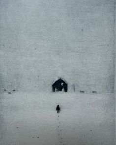 two people walking in the snow towards a barn on a foggy, overcast day