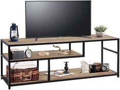 an entertainment center with two shelves and a flat screen tv on it's stand