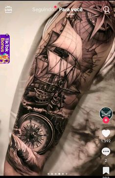 a man's arm with a clock and ship on it