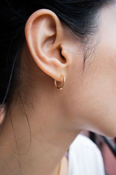 Earrings Gold-plated brass Round Life is made better by the simple things, like a hug from a friend. These delicate golden hoops evoke the same emotion. The same as our mini/small huggie hoops, just a tad smaller. Weight: 2g/pairMini hoop: 14k gold-plated brass, diameter 14mm, thickness 1mmSmall hoop: 14k gold-plated brass, diameter 18mm, thickness 2mm Small Round Earrings, Small Ring Earrings, Tiny 14k Gold Hoop Earrings For Everyday, Simple 14k Gold Huggie Earrings For Everyday, Simple Everyday 14k Gold Huggie Earrings, Everyday Simple 14k Gold Huggie Earrings, Classic Tiny Cartilage Earrings For Everyday Wear, Gold Huggie Earrings For Everyday, 14k Gold Filled Cartilage Earrings For Everyday