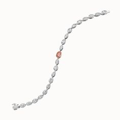 Flamingo pink is not just a color; it stands for potential, romance and balance. Oval and marquise diamond bracelet features a fancy intense orangy-pink oval diamond center piece set in rose gold. Created diamond 8.37ctw Fancy intense orangy-pink diamond, 1.05ct 14k white and rose gold Special order Luxury Pink Diamond Bracelet For Formal Occasions, Pink Diamond Bracelet With Gemstone Fine Jewelry, Luxury Pink Diamond Bracelet, Rose Gold Hand-set Diamond Bracelet, Pink Diamond Bracelet For Gift, Fine Jewelry, Marquise Diamond, Pink Bracelet, Oval Diamond, Pink Diamond