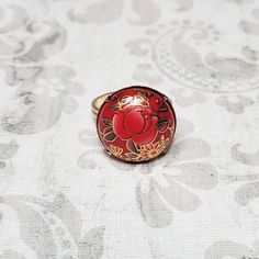 Adjustable Hand Painted Rings As Gifts, Adjustable Hand Painted Rings For Gift, Red Cabochon Ring Jewelry, Red Cabochon Jewelry As A Gift, Red Cabochon Jewelry Gift, Red Nickel Free Rings, Handmade Adjustable Enamel Ring As Gift, Elegant Red Hand Painted Jewelry, Adjustable Red Cabochon Jewelry