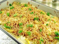 a casserole dish filled with meat and vegetables