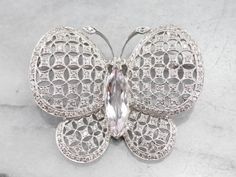 This is a stunning vintage brooch, crafted with high-quality materials that the butterfly appears to move as the light flows over its morganite body and glittering diamond wings crafted in highly polished platinum. This is an elegant brooch, a perfect signature piece, ready to wear or gift. Love this piece, but want to make it more versatile? We here at Market Square Jewelers, along with our master metalsmiths can convert this fantastic brooch into a necklace or pendant for an additional fee. Pl Elegant Silver Butterfly Brooch, Elegant Silver Butterfly Brooches, Elegant Butterfly Brooches For Evening, Elegant Brooch, Diamond Butterfly, Jewelry Diamonds, Market Square, Morganite Diamond, Ceylon Sapphire