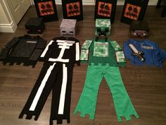 several minecraft costumes are laid out on the floor