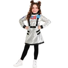 a girl in an astronaut costume posing for the camera with her hands on her hips