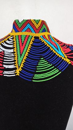 African wedding necklace, Zulu necklace, Beaded shawl necklace, African jewelry, Masai necklace, Bridesmaid necklace, Wedding gift This stunning necklace is superbly crafted with fine beads. The necklace can be worn with any outfit at different occasions and it will absolutely makes you stand out. 100% handmade using fine beads. Closure: ball joint Color: multicolor 3-5 days delivery via DHL Express The shipping fee is for the first item only and additional necklaces or items ship for free. Whol Traditional Colorful Beaded Necklaces For Celebrations, Multicolor Beaded Choker For Wedding, Traditional Beaded Necklaces For Celebrations With Colorful Beads, Wedding Multicolor Beaded Chain Beads, Multicolor Handmade Choker For Wedding, Bohemian Multicolor Beaded Necklaces For Wedding, Bohemian Multicolor Beaded Necklace For Wedding, Multicolor Beaded Chain Necklace For Wedding, Multicolor Beaded Necklace For Wedding