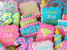 decorated birthday cookies in pink, blue and green