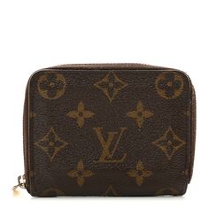 This is an authentic LOUIS VUITTON Monogram Zippy Coin Purse. This wallet is crafted of traditional Louis Vuitton monogram coated toile canvas in brown. The gold-toned zipper opens to a terra cotta crossgrain leather interior with card slots and pockets. Terra Cotta, Leather Interior, Authentic Louis Vuitton, Louis Vuitton Monogram, Card Slots, Slots, Coin Purse, Coin, Louis Vuitton