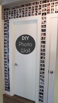 a white door sitting inside of a bathroom next to a wall with pictures on it