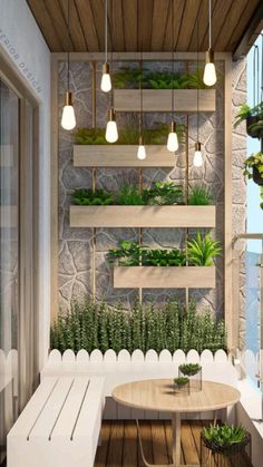 a balcony with potted plants on the wall and wooden table in front of it