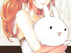 a girl with red hair holding a white bunny in her arms and looking at the camera