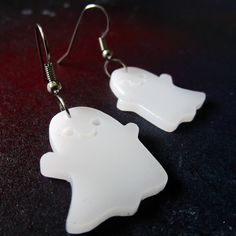 "These cute Happy Ghost Dangle Earrings are made of matte finish semi-translucent laser cut white acrylic and are surprisingly lightweight! Wear with your everyday decora outfits or harajuku costumes to haunt your unique style! 👻 Adorable Happy Ghost Pendants measure about 1\" from top to bottom. 👻 Lightweight kawaii statement earrings dangle from your choice of earring hooks! Pick from: ~ Nickel Free ~ Stainless Steel ~ Plastic Hooks ~ Clip Ons ~ Titanium Hooks 👻 Comes on brand name over-siz Handmade White Plastic Earrings, White Spooky Earrings For Party, Spooky White Earrings For Party, Cute White Halloween Earrings, Novelty White Earrings For Pierced Ears, Fun White Halloween Earrings, Novelty White Dangle Earrings, Hypoallergenic White Jewelry For Halloween, Spooky White Earrings For Halloween