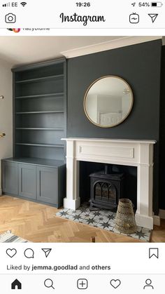 an instagram photo of a living room with fireplace and built - in bookshelves