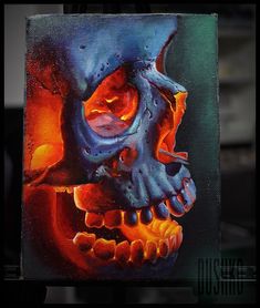 an oil painting of a skull with orange and blue colors on it's face