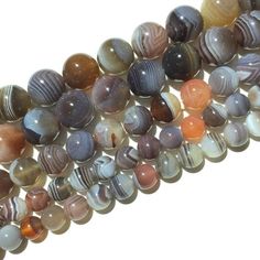 multicolored agate beads are stacked on top of each other