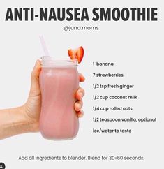 a hand holding a pink smoothie with strawberries in it and the text, anti - nausea smoothie