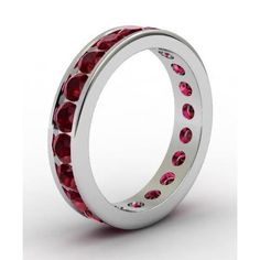 a white gold ring with red stones