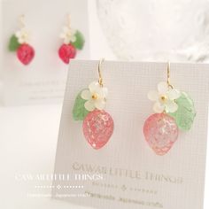 - Please read the full description below - Strawberry earrings - Pink (Gradation effect) / with or without flower. *Each batch has a slightly different shade *Colours change depending on the angle of viewing  * Please note, earring hooks are Hypoallergenic. However, the rest of the parts are not. * Colours are graded and each one is unique - Please refer to the pictures I am trying to capture the colours of the items as best as possible, however, colours may vary slightly due to lighting conditi Pink Resin Jewelry For Summer, Pink Fruit Design Earrings, Summer Pink Resin Jewelry, Summer Pink Earrings With Fruit Design, Cute Fruit Design Earrings, Trendy Pink Jewelry With Fruit Design, Pink Fruit Design Jewelry, Summer Pink Fruit Design Earrings, Cute Berry Colored Jewelry With Fruit Design