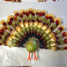 a turkey made out of fruit and grapes