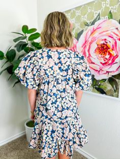 Adorned with a delightful floral print in soft blue, light pink, and cream, this mini dress features smocked shoulders and puff sleeves that add a touch of whimsy. With its flowy fit and ruffle hem, it’s ideal for a breezy fall day at a pumpkin patch, a casual brunch with friends, or even a fun date night! PRODUCT FIT - TRUE TO SIZE MODEL DETAILS - BRENNA IS WEARING A SIZE SMALL, 5'3" BUST CIRCUMFERENCE -SMALL 36", MEDIUM 38”, LARGE 40” LENGTH -SMALL 33.5", MEDIUM 34.5”, LARGE 35.5” FABRIC CONTE Cute Puff Sleeve Dress With Gathered Sleeves For Brunch, Spring Brunch Puff Sleeve Dress With Ditsy Floral Print, Cute Floral Print Dress With Puff Sleeves, Cute Puff Sleeve Dress With Gathered Sleeves For Spring, Blue Floral Print Puff Sleeve Dress, Flowy Puff Sleeve Dress With Floral Print For Brunch, Floral Print Puff Sleeve Dress For Brunch, Puff Sleeve Dress With Floral Print For Brunch, Cute Dresses With Gathered Sleeves For Brunch