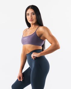 HIGHLIGHTS. Seamless construction Rib bra band for support Low to Medium impact Moisture-wicking breathable fabric Flattering scoop neckline A/B cup size FIT SUGGESTION. This item runs true to Alphalete's standard seamless fit.. We recommend sizing up for a comfortable fit.. Brooke is 5’5”/165cm, wearing a size S with a 35”/88.9cm bust. MATERIALS AND WASHING DIRECTIONS. 51% Polyamide, 38% Polyester, 11% Elastane. We recommend washing inside-out on a cold setting. Hang to dry DESCRIPTION With the Seamless Sculpting Workout Bra, Seamless Scoop Neck Workout Bra, Seamless Scoop Neck Sports Bra For Workout, Light Support Scoop Neck Sports Bra For Light Exercise, Scoop Neck Sports Bra With Light Support For Exercise, Seamless Sculpting Sports Bra In Athleisure Style, Seamless Scoop Neck Sports Bra For Training, Athleisure Seamless Sculpting Sports Bra, Fitted Purple Sports Bra With Seamless Construction