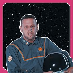 a man holding a black object in front of a pink background with space and stars