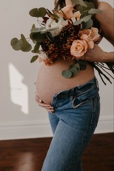 a pregnant woman with flowers in her belly