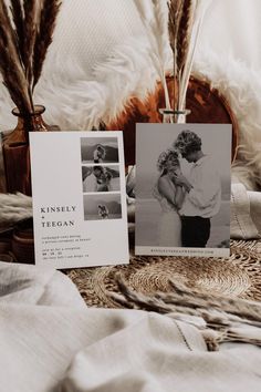 a couple's wedding photos are displayed on a bed with feathers in the background