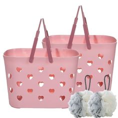 two pink bags with hearts on them and one bag has pom - poms