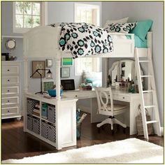 a white loft bed sitting under a window next to a desk