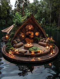 a floating house with candles lit up on it's roof and surrounded by greenery