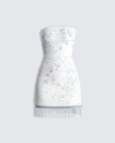 a white dress that is on top of a table