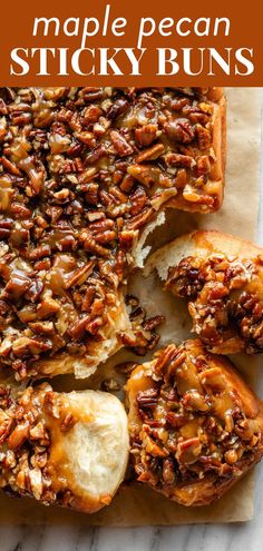 maple pecan sticky buns on a piece of parchment paper with text overlay that reads maple pecan sticky buns