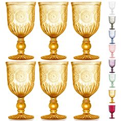 six gold goblets are lined up in different colors and sizes, each with an ornate design on the rim