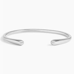 Silhouette Cuff Bracelet - Silver. A lustrous strand of metal ending in two hourglass shapes forms this chic and trendy cuff bracelet. Dainty Silver Jewelry Aesthetic, Trendy Cuff Bracelet, Queer Jewelry, Bangle Bracelets Silver, Types Of Bracelets, Silver Bracelet For Women, Cuff Bracelet Silver, Tacori Engagement Rings, California Gold